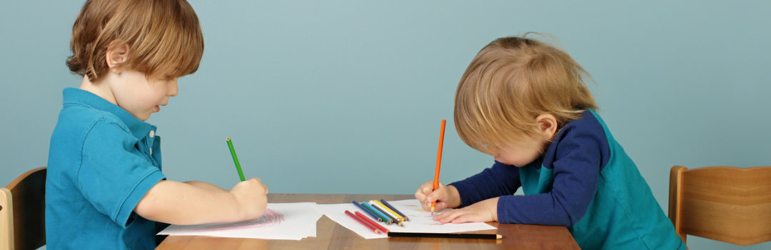 two children writing